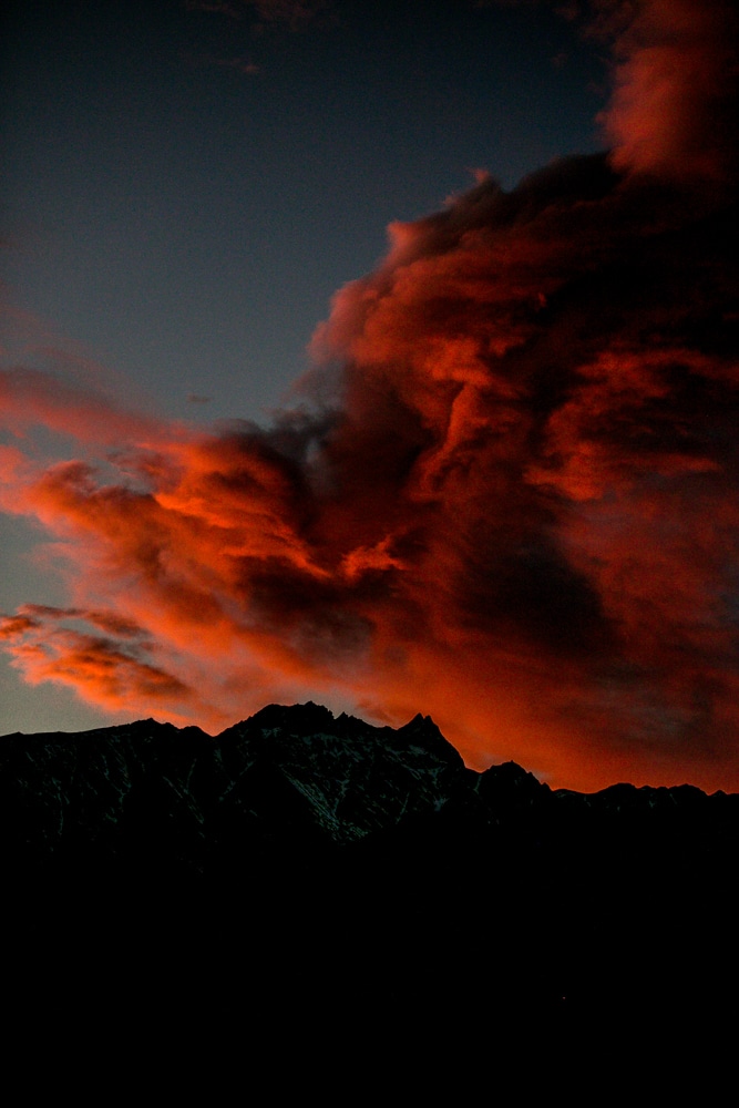 A picturesque red cloud captured in Queenstown, NZ travel photos.