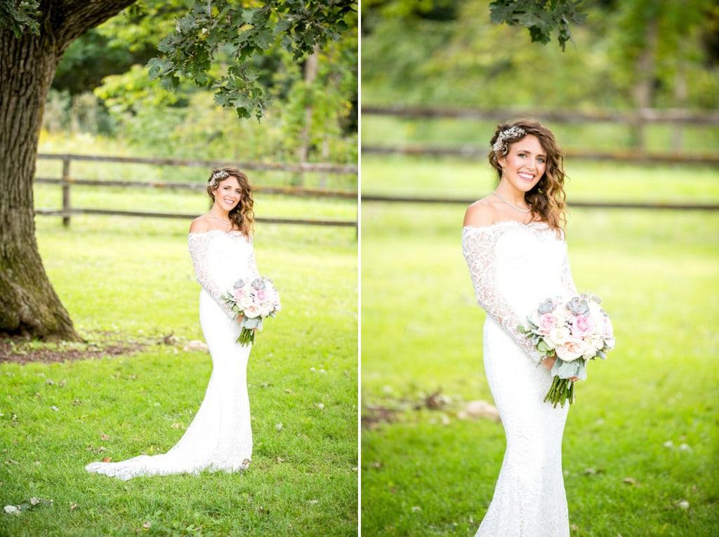 A Rochester bride in a white dress standing in front of a tree.