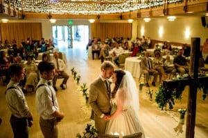 A bride and groom exchange a kiss at their Silverthorne, CO wedding ceremony.