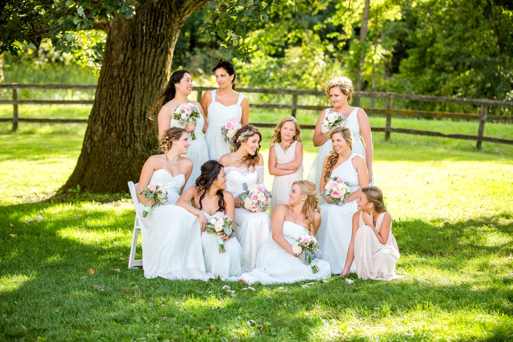 Rochester bridal party posing under a tree.