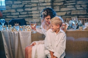 A woman and her son sitting at a table at Mayowood Stone Barn wedding venue.