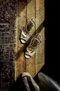 A pair of shoes sitting on a wooden floor at River View Winery.