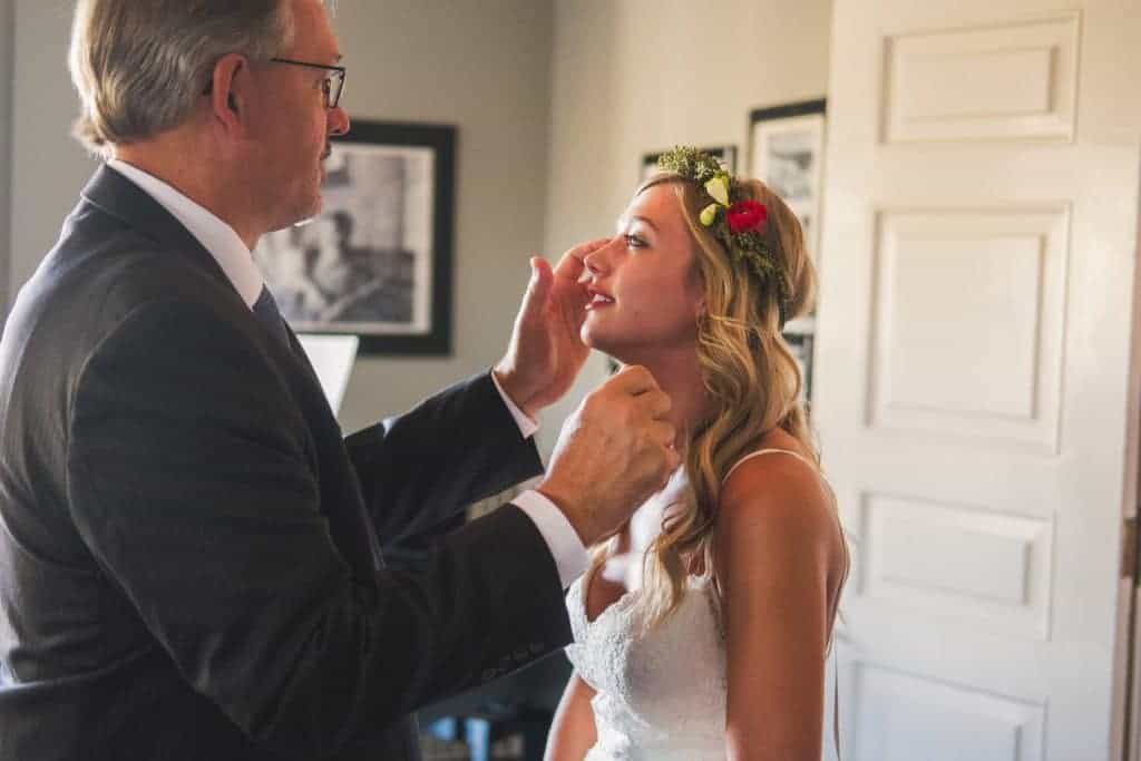 Littleton Wedding Photographer captures the moment when a man crowns the bride.