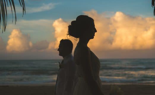 Silhouette of a bride and groom on the beach at Excellence Punta Cana Wedding.