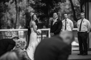 A black and white photo of a wedding ceremony.