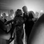 A bride and groom dancing on the dance floor, showing their love down by the Mighty Mississippi at their wedding.
