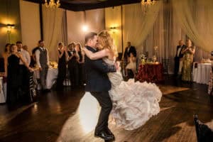 A Court Above Main: A bride and groom sharing their first dance at their wedding reception.
