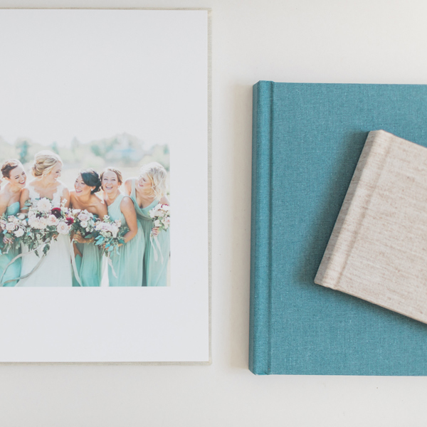 A photo of bridesmaids sitting next to a book, symbolizing a meaningful investment in cherished memories.