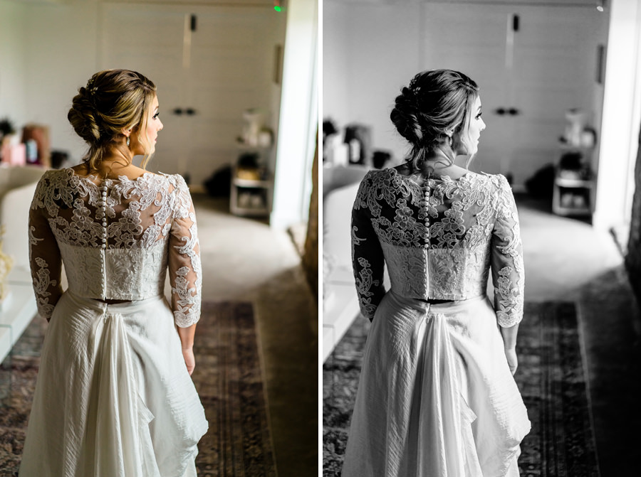 A bride in a wedding dress looking at herself in a mirror.