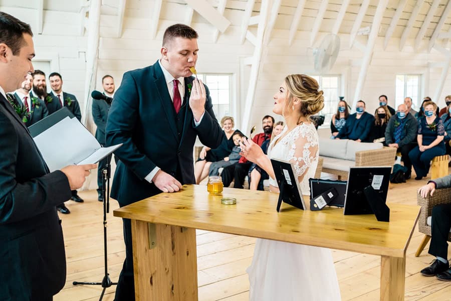 A bride and groom exchange vows at a wedding ceremony.