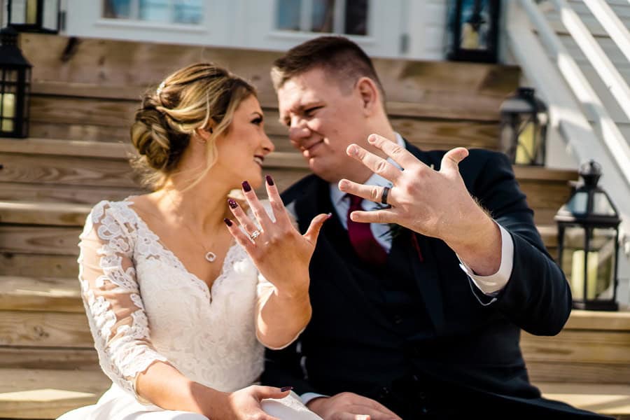 A bride and groom posing for a wedding photo.