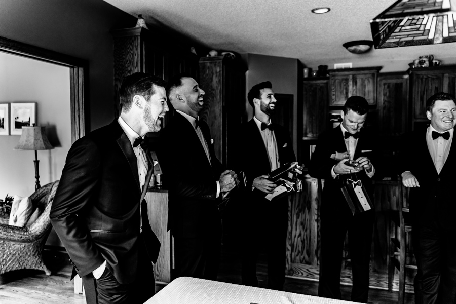 Black and white photo of groomsmen in tuxedos.