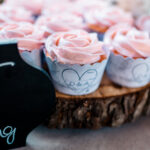 Emotional backyard wedding with cupcakes on a table.