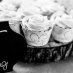 A black and white photo of emotional backyard wedding cupcakes.