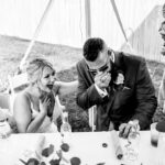 A emotional backyard wedding in La Crosse captured in a black and white photo featuring a bride and groom.