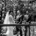 Keywords used: bride, groom  Bride and groom's love-filled backyard wedding captured in a black and white photo.