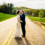 A bride and groom kiss in the middle of a love-filled Trempleau wedding.