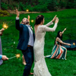 Backyard wedding with sparklers and love-filled atmosphere featuring Courtney and James.
