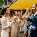 A love-filled wedding reception where Courtney and James' group of brides and grooms toast in their backyard.