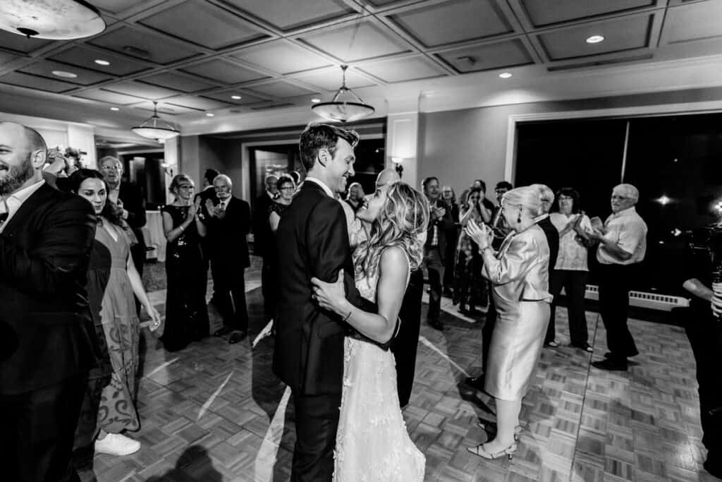 A bride and groom sharing their first dance at a wedding reception.