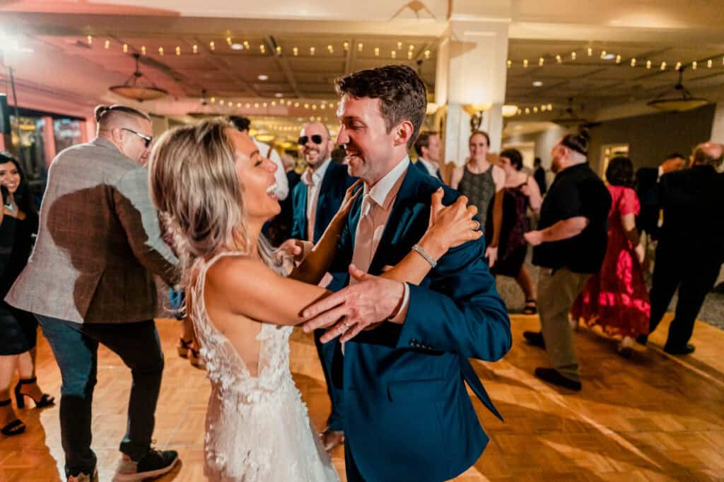 A bride and groom dancing at their wedding reception.