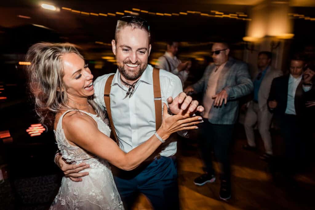 A bride and groom dancing at their wedding reception.