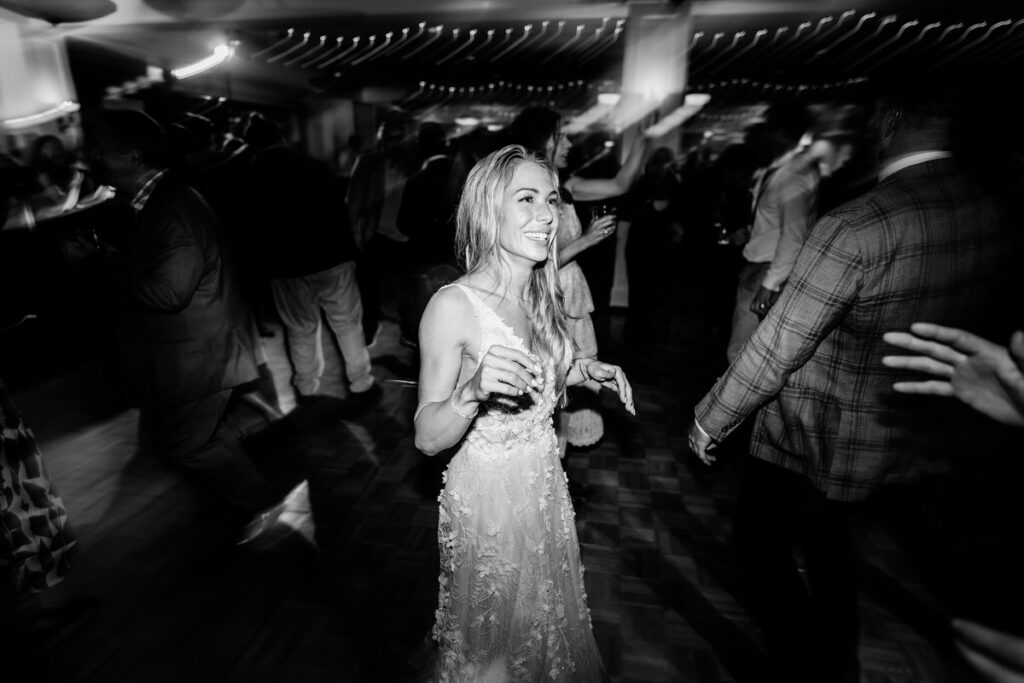 A bride dancing on the dance floor at a wedding.