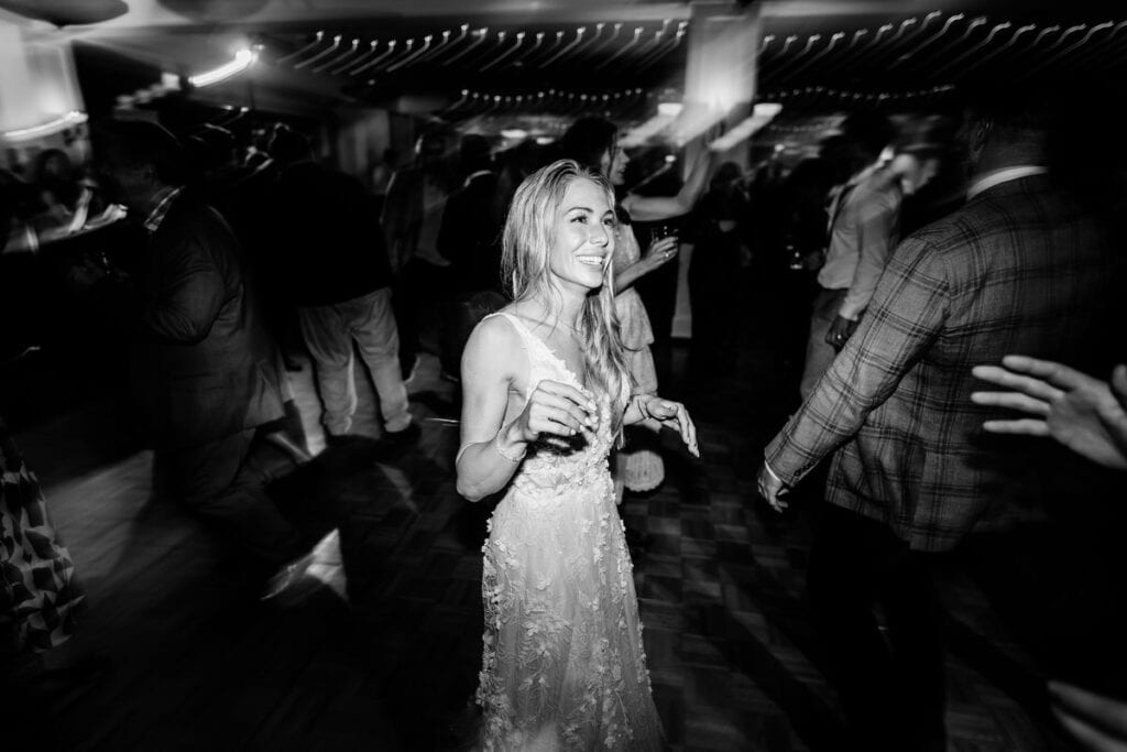 A bride dancing on the dance floor at a wedding.