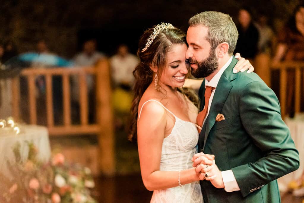 A bride and groom sharing their first dance at their wedding reception.