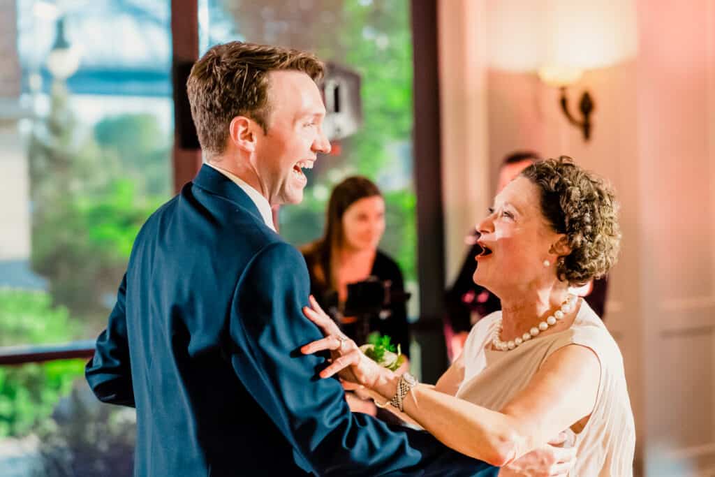 A man and woman dancing at a wedding reception.