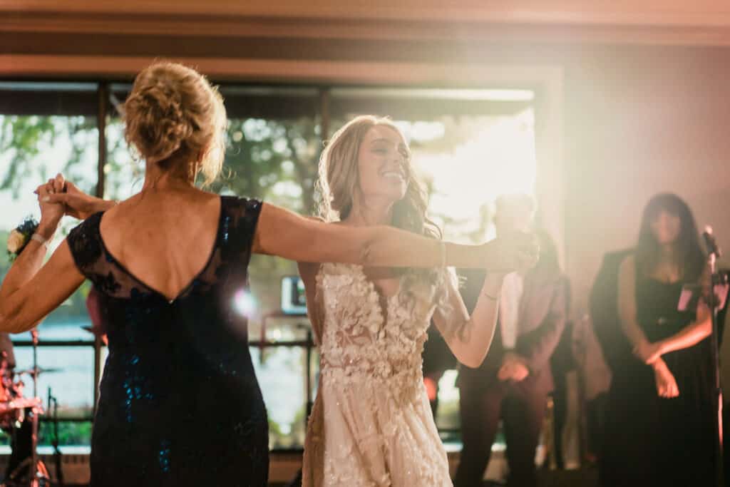 A bride and groom dancing at a wedding reception.