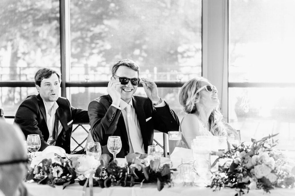 A black and white photo of a group of people at a wedding.