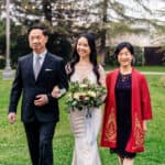 Asian bride and groom walking down the aisle.