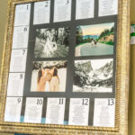 A framed photo of a wedding seating chart on a easel.