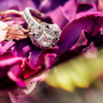 Engagement rings on a purple flower.