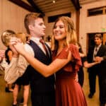 A man and woman dancing at a wedding reception.