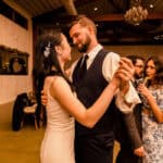 A bride and groom sharing their first dance at their wedding reception.