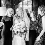 A black and white photo of a bride and her bridesmaids.