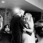 A bride and groom share their first dance at their wedding.