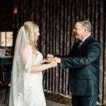 A bride and her father sharing their first dance.
