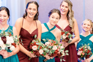 A group of bridesmaids holding bouquets.