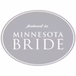 Gray oval badge with white text that reads "featured in MINNESOTA BRIDE," showcasing the work of a La Crosse wedding photographer.